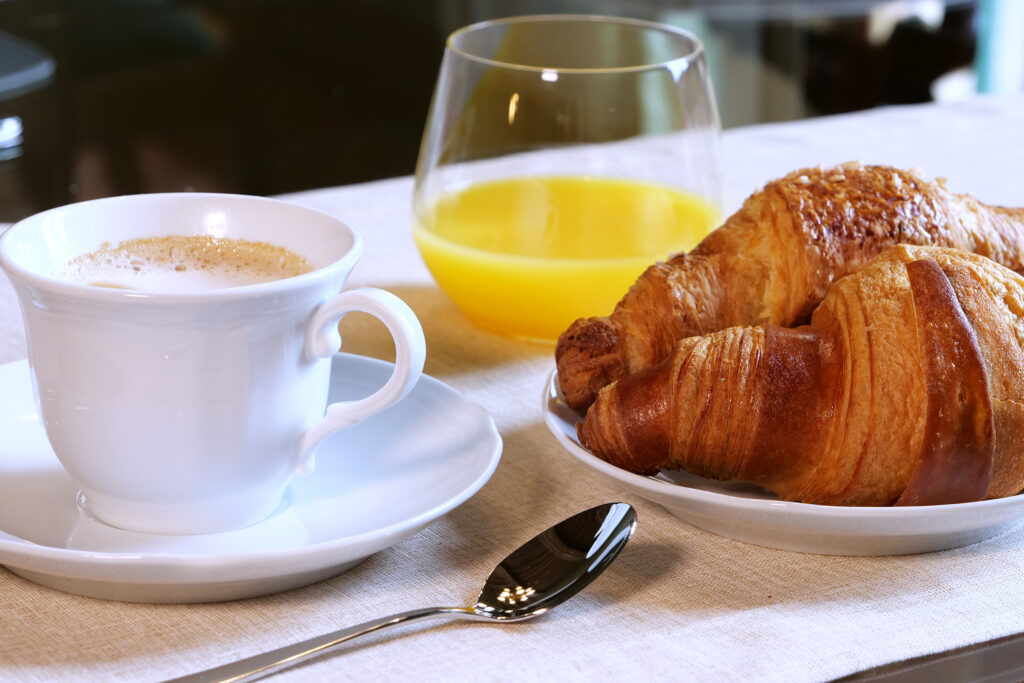 Cappuccino, croissant and seasonal fresh juice